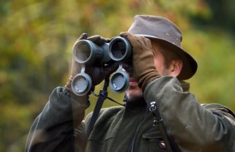 hunter using binoculars