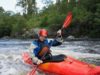 Man kayaking in river