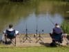 recreational fishers on the river bank