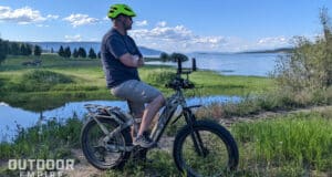 Man sitting on QuietKat Ranger looking at lake